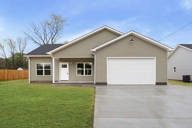 ranch-style house featuring concrete driveway, an attached garage, fence, a front lawn, and central AC unit