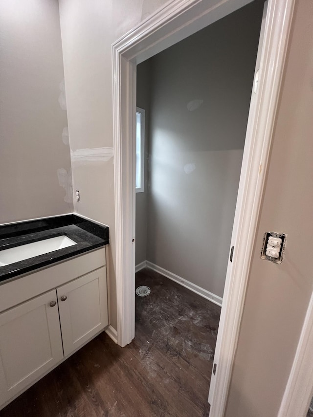 bathroom featuring hardwood / wood-style flooring and vanity