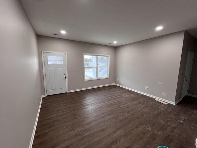 foyer entrance featuring dark hardwood / wood-style floors