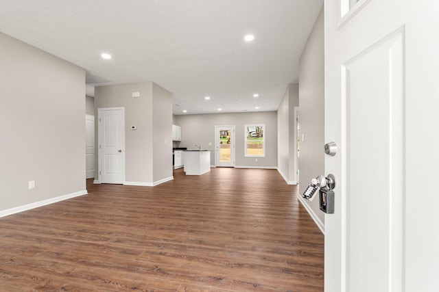 805 Shepard St S, Winchester, TN 37398 - unfurnished living room with baseboards, recessed lighting, and dark wood-style flooring
