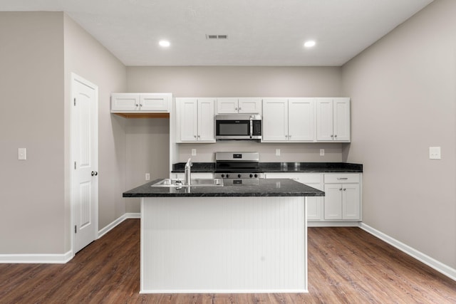 805 Shepard St S, Winchester, TN 37398 - kitchen with an island with sink, white cabinets, a sink, and appliances with stainless steel finishes