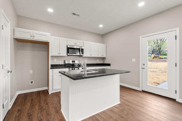 805 Shepard St S, Winchester, TN 37398 - kitchen with white cabinetry, dark wood finished floors, a sink, visible vents, and appliances with stainless steel finishes