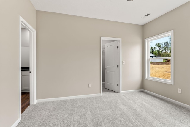 805 Shepard St S, Winchester, TN 37398 - unfurnished bedroom with a spacious closet, carpet floors, baseboards, and visible vents