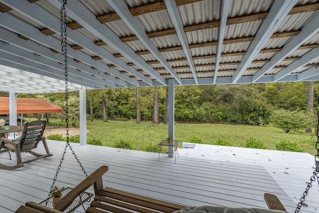 wooden terrace featuring a yard