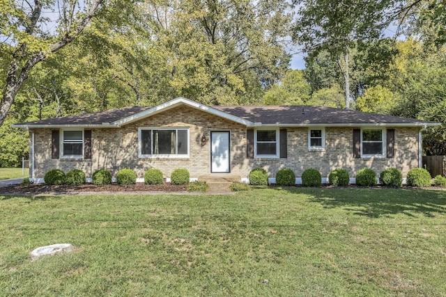 ranch-style home featuring a front yard