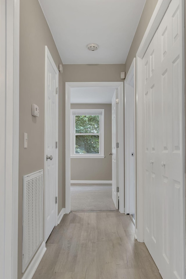 hallway featuring light hardwood / wood-style flooring