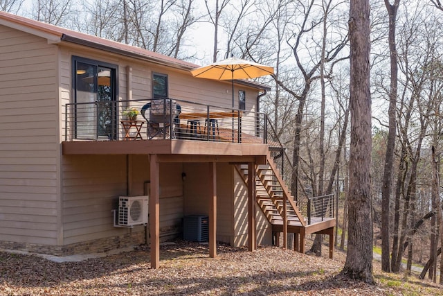 rear view of property featuring central AC and ac unit