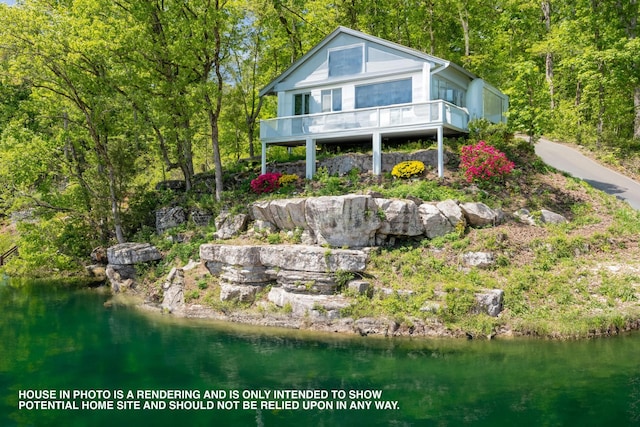 rear view of property featuring a water view