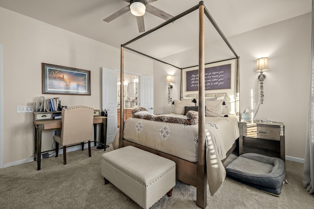 bedroom with ceiling fan, ensuite bathroom, and carpet