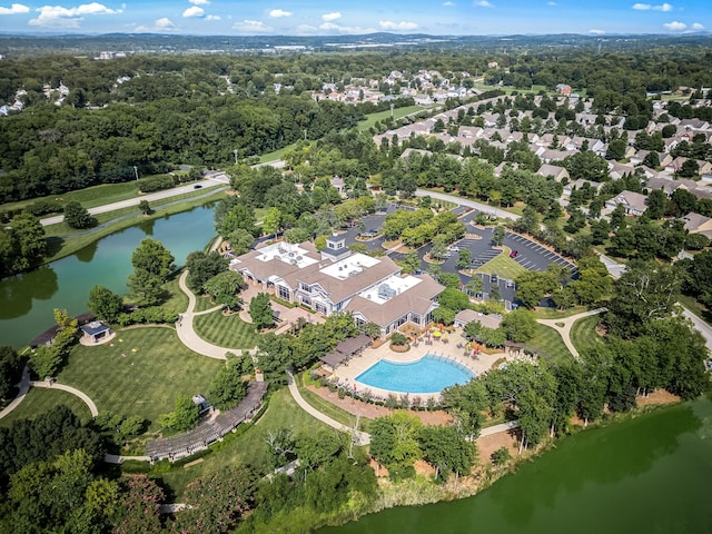 birds eye view of property with a water view