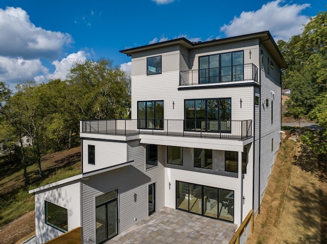 back of house with a balcony