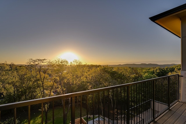 view of balcony at dusk