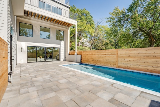 view of swimming pool featuring a patio area