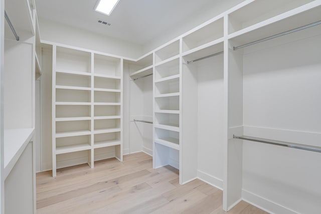 spacious closet featuring light hardwood / wood-style flooring