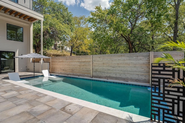 view of pool featuring a patio