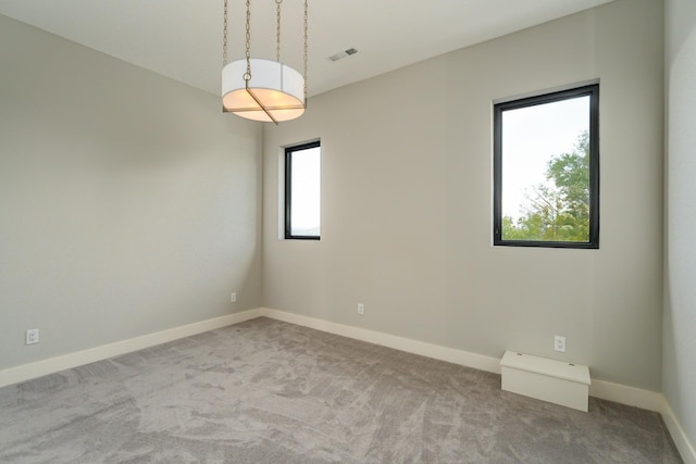 empty room featuring light colored carpet