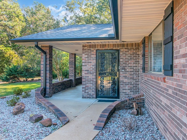 doorway to property with a patio