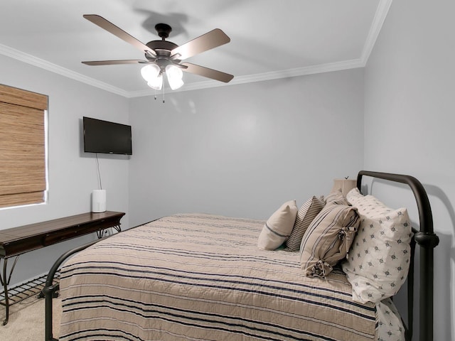 bedroom featuring crown molding, ceiling fan, and carpet