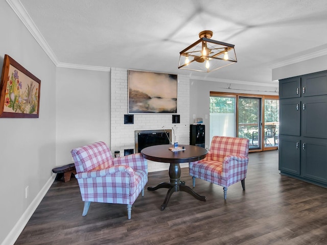 living room with ornamental molding, a brick fireplace, dark wood-type flooring, and a textured ceiling