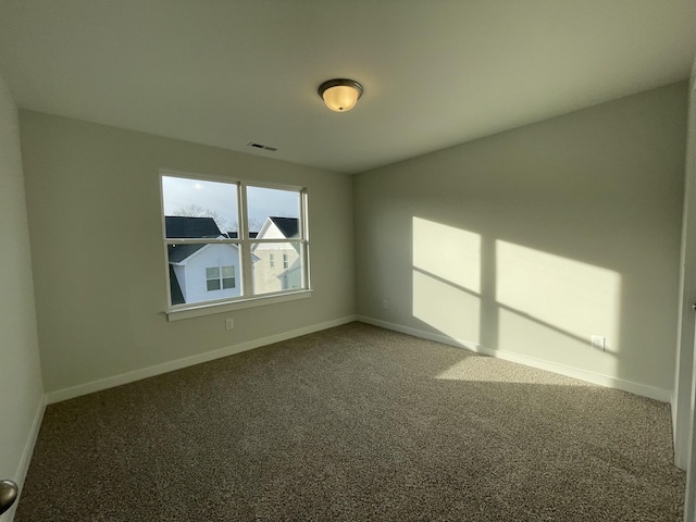 empty room featuring carpet flooring