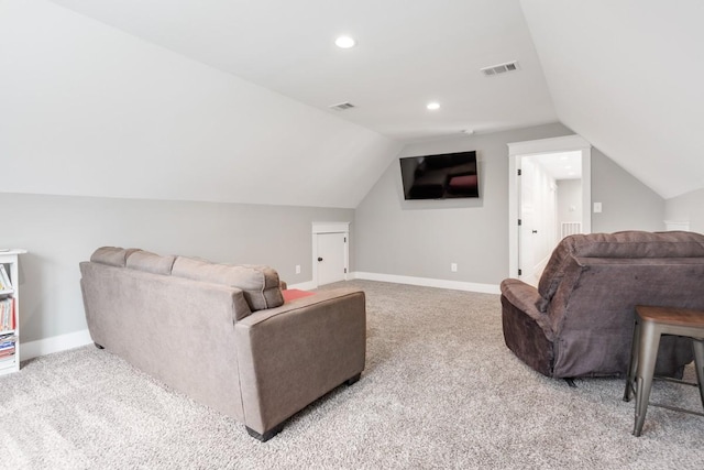 living room featuring lofted ceiling and light colored carpet