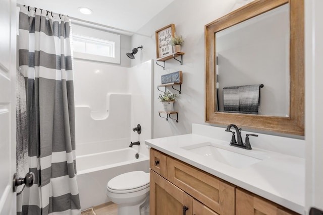 full bathroom featuring shower / tub combo with curtain, vanity, and toilet