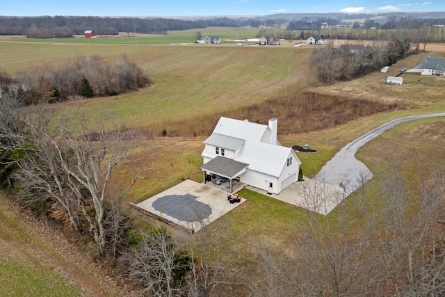 birds eye view of property featuring a rural view