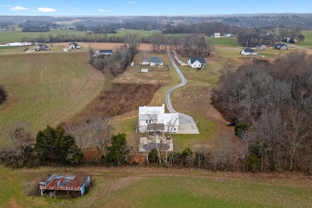 birds eye view of property with a rural view