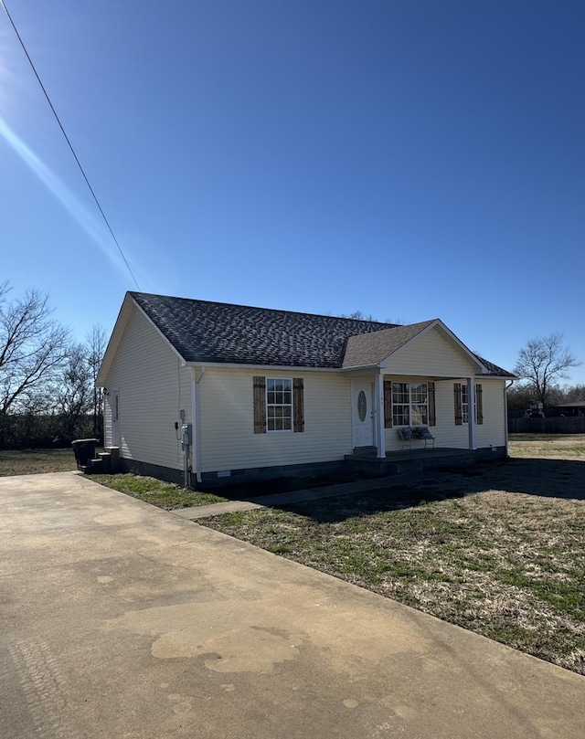 single story home featuring covered porch