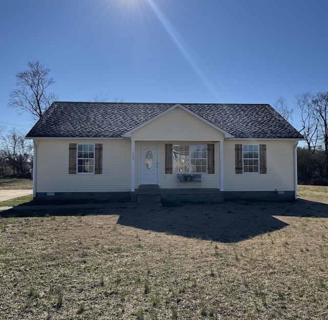 ranch-style home featuring a front yard