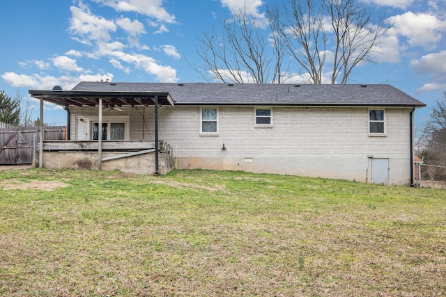 back of property featuring a yard