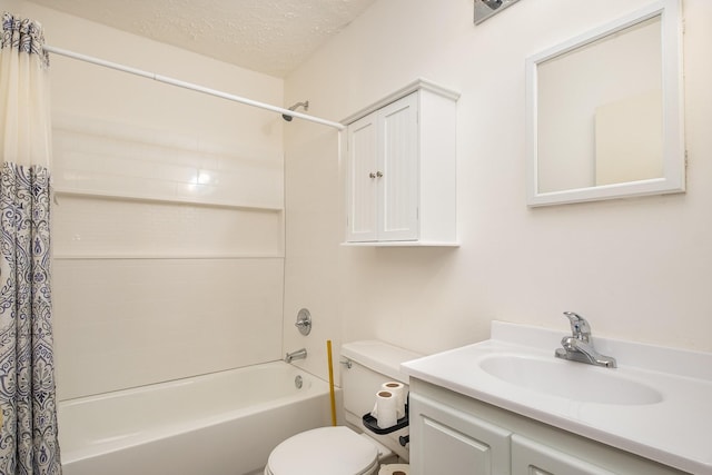 full bathroom with shower / tub combo with curtain, vanity, toilet, and a textured ceiling