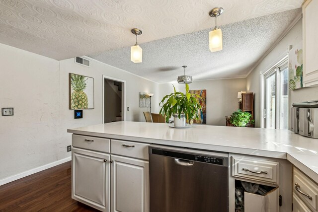 kitchen featuring dark wood-type flooring, decorative light fixtures, dishwasher, and a textured ceiling