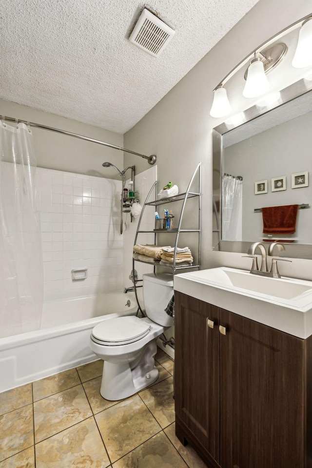 full bathroom featuring tile patterned flooring, vanity, shower / bath combination with curtain, a textured ceiling, and toilet