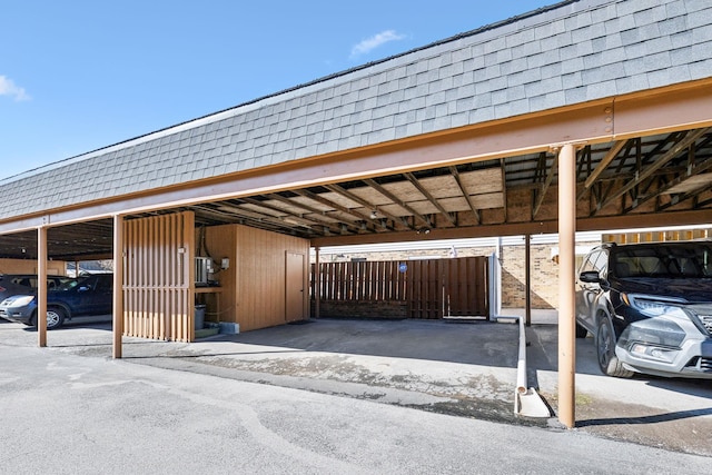 view of parking / parking lot with a carport