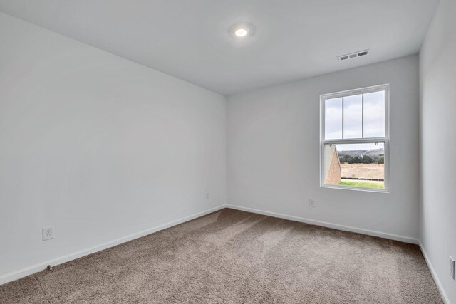 unfurnished room with carpet flooring