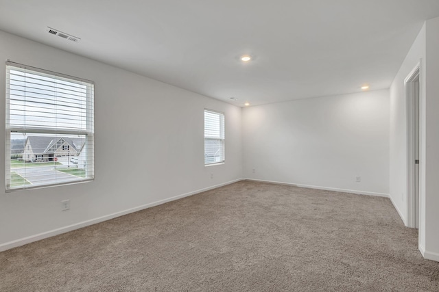 unfurnished room with carpet flooring