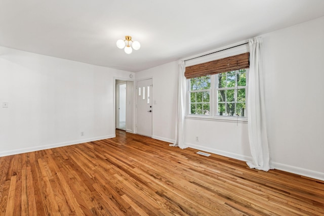 spare room with light hardwood / wood-style flooring