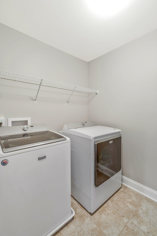 laundry room with independent washer and dryer