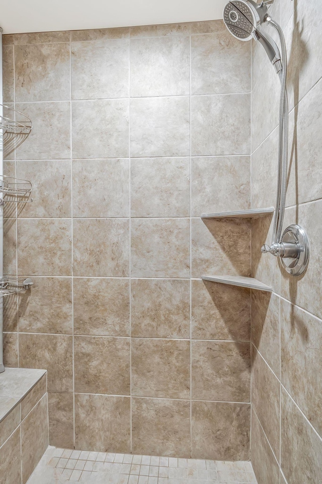 bathroom with tiled shower