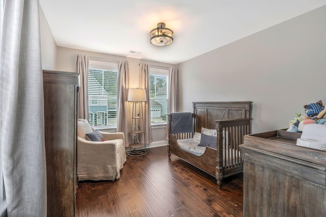 bedroom featuring dark hardwood / wood-style floors