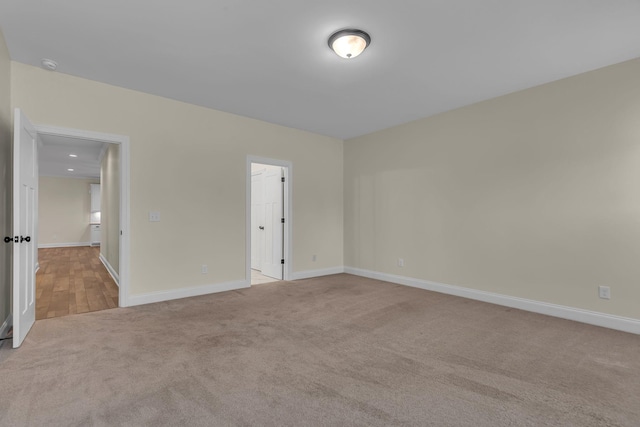 spare room with light carpet