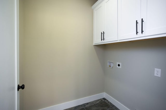 clothes washing area with baseboards, cabinet space, hookup for an electric dryer, and hookup for a washing machine