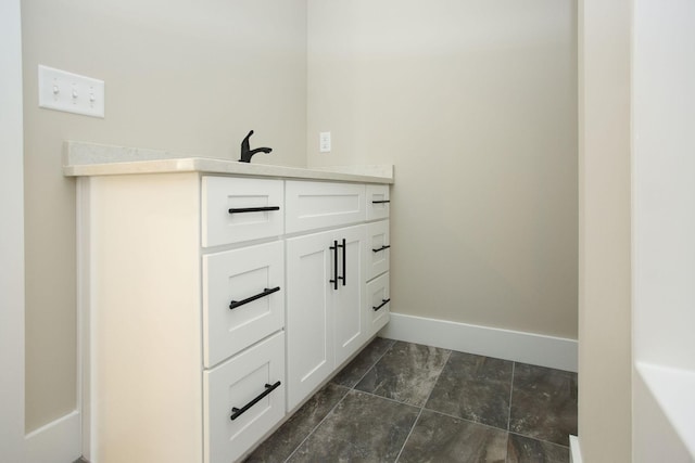 bathroom with baseboards