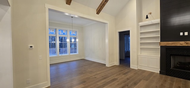 unfurnished living room with dark wood-type flooring, vaulted ceiling with beams, and built in features