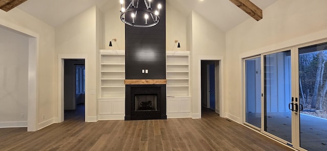 unfurnished living room featuring beam ceiling, high vaulted ceiling, dark hardwood / wood-style flooring, built in features, and a fireplace