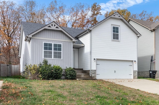 view of front of home with a garage and a front yard