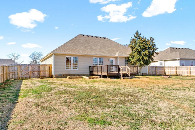 rear view of property with a gate, crawl space, a fenced backyard, and a lawn