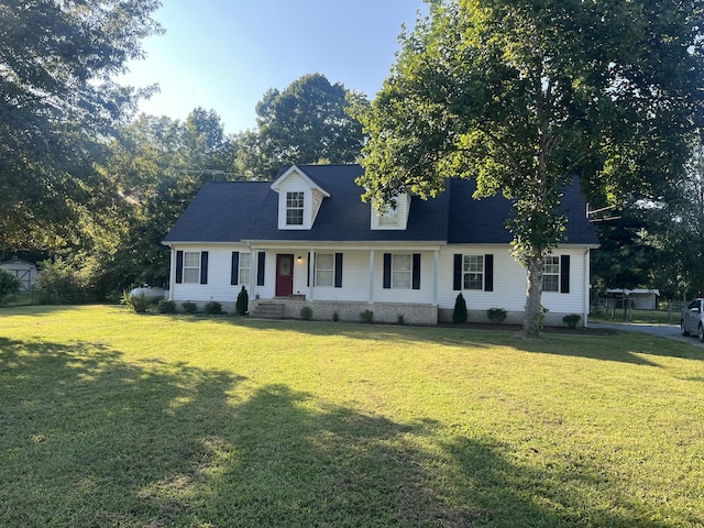 cape cod house featuring a front lawn