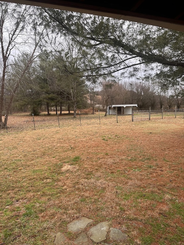 view of yard with a rural view